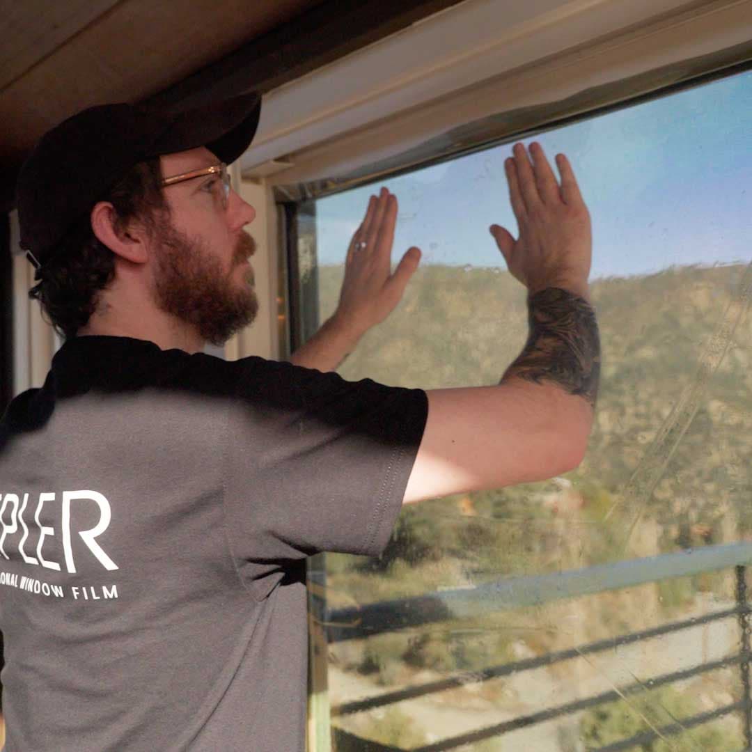 Installer applying film